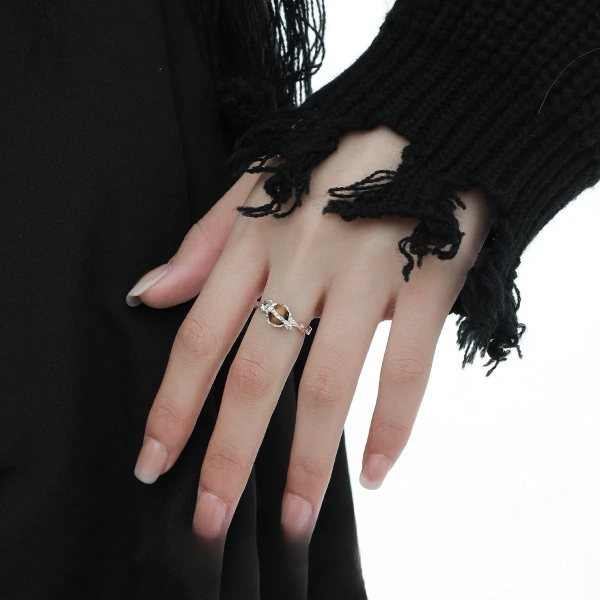 Adjustable opening Saturn ring in white gold colour tone on silver material