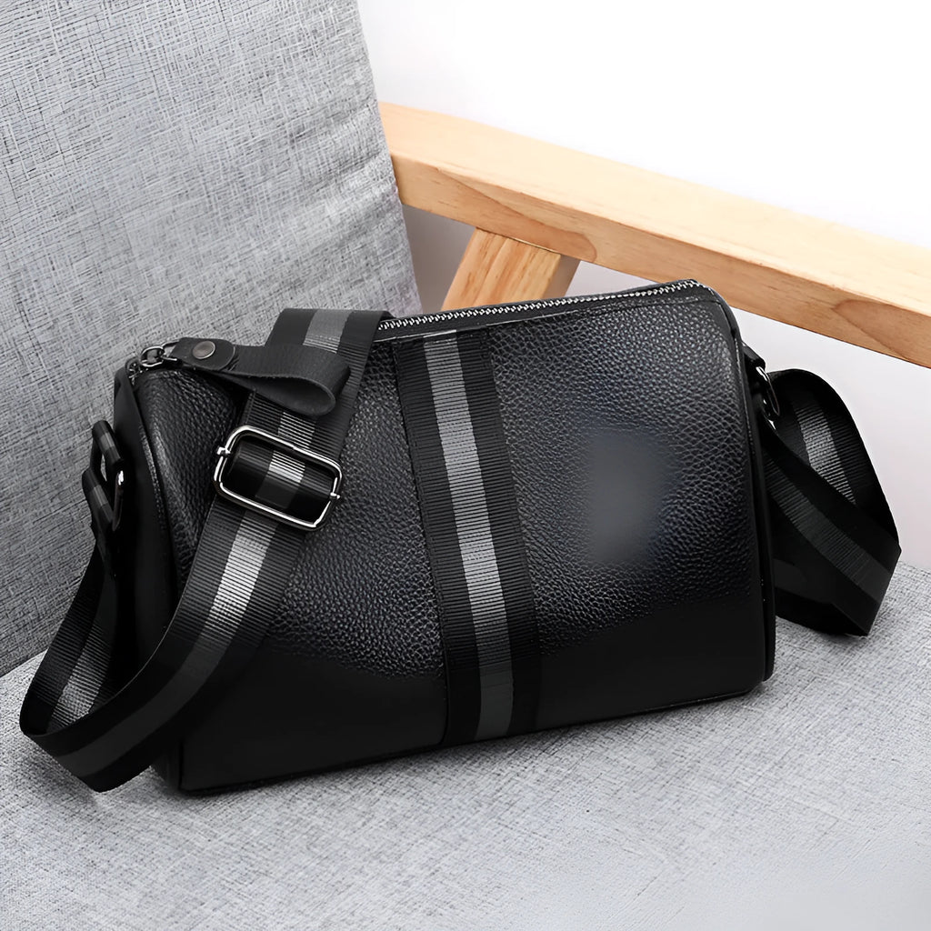 Black genuine leather crossbody shoulder bag showing 24cm height with polyester lining