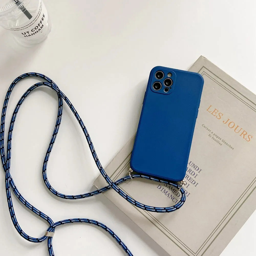 Liquid silicone phone case with crossbody lanyard for iPhone 13 Pro in black, showing rear cover and attached strap