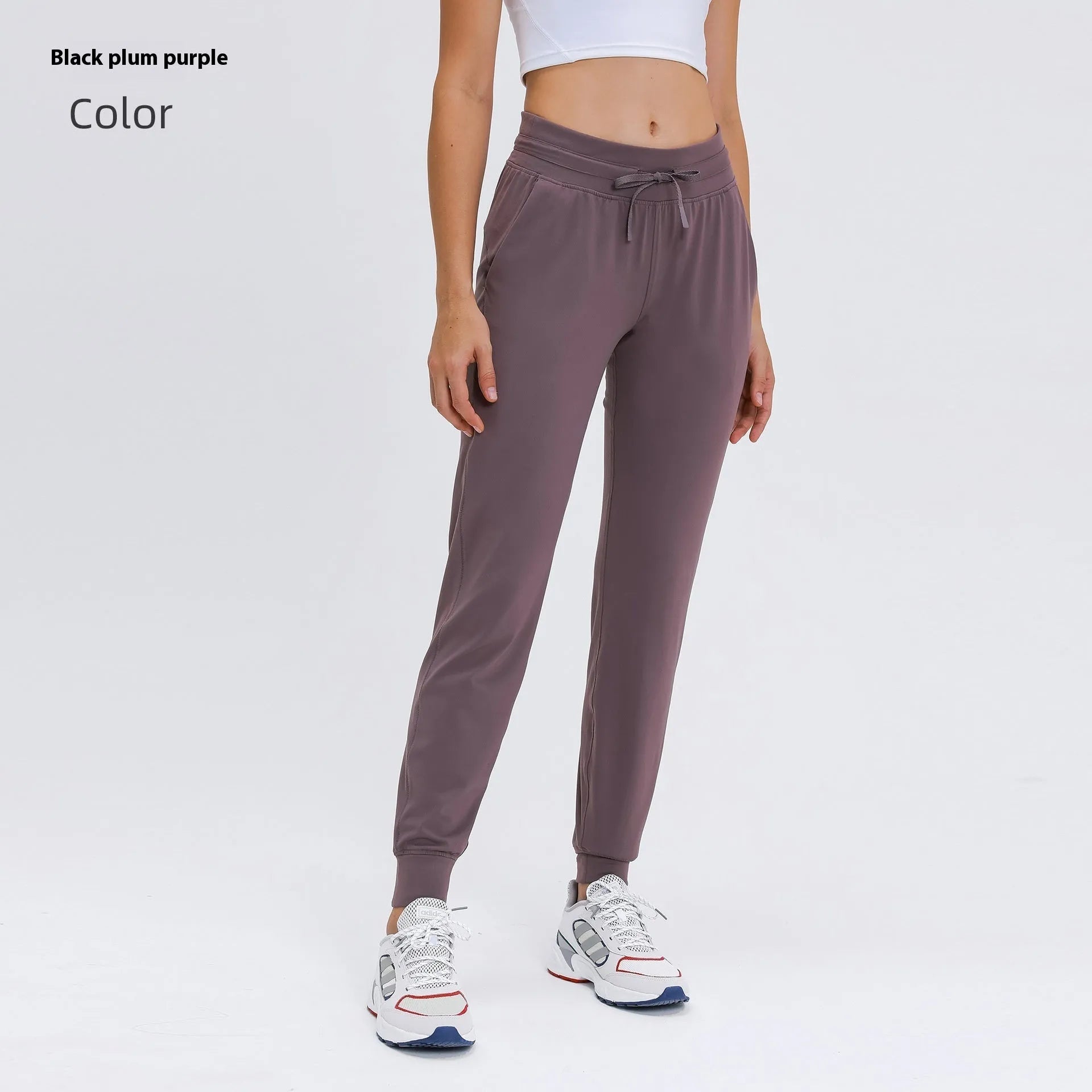 Women's high-waist yoga pants in distilled coffee colour with an elastic drawstring waist for fitness.