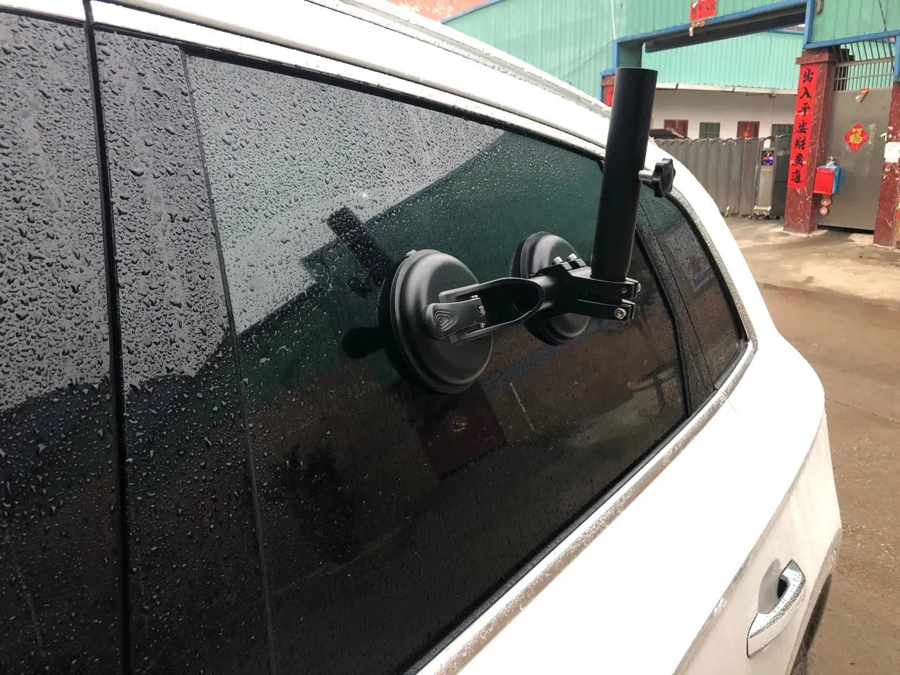 Black off-road car flagpole sucker base with round glass suction cup and rubber disc.