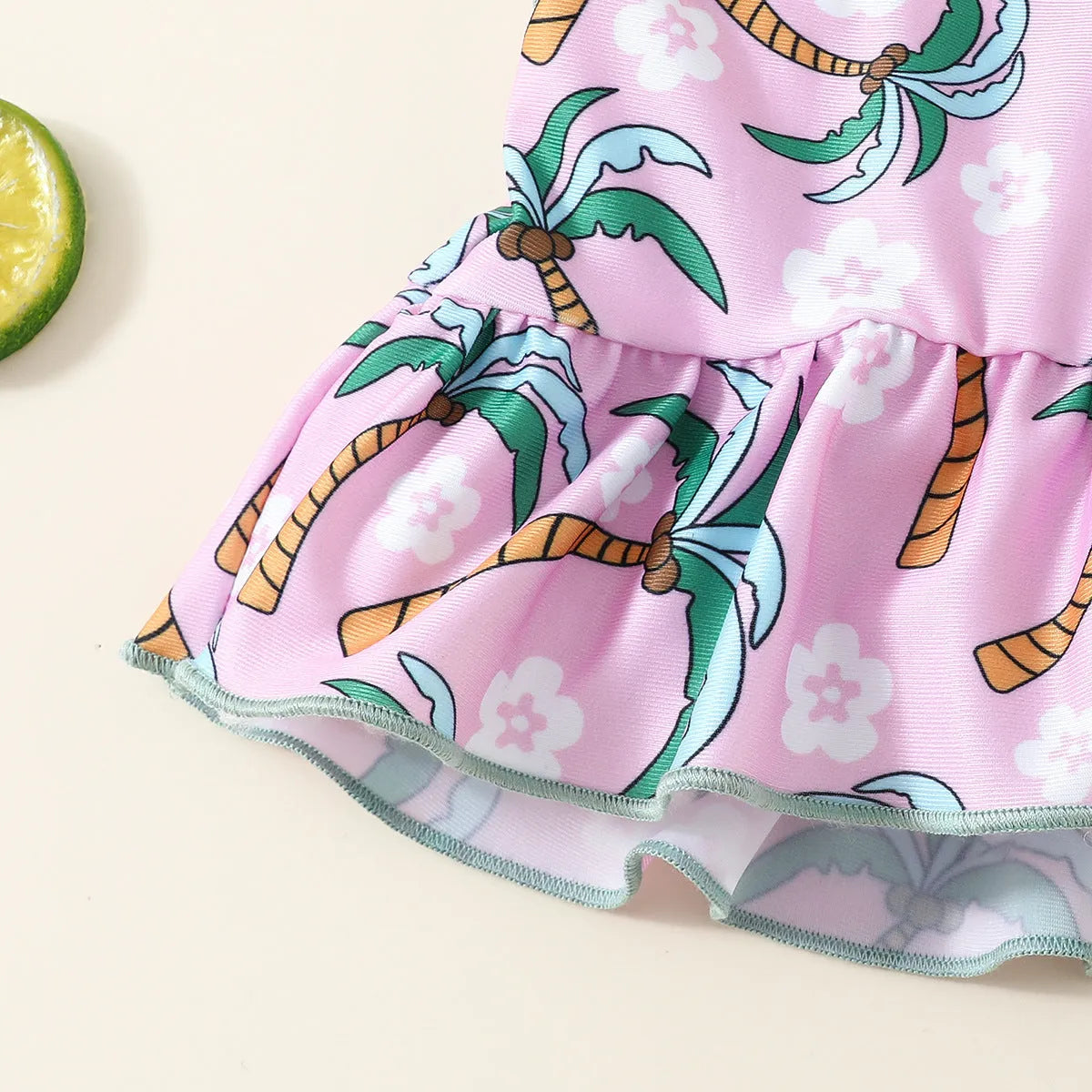 White children's two-piece swimsuit set with top and beach shorts on hanger
