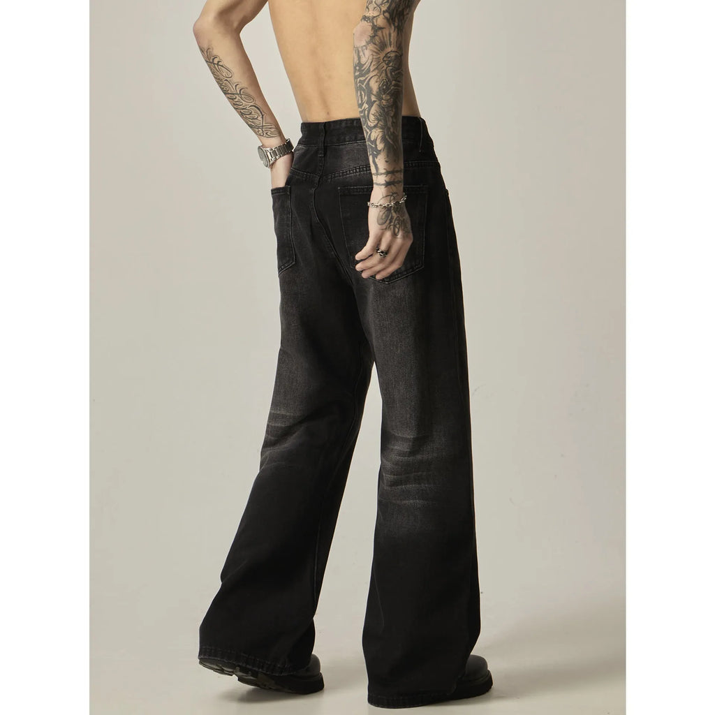 Black straight leg jeans with loose retro styling and basic zip fly design