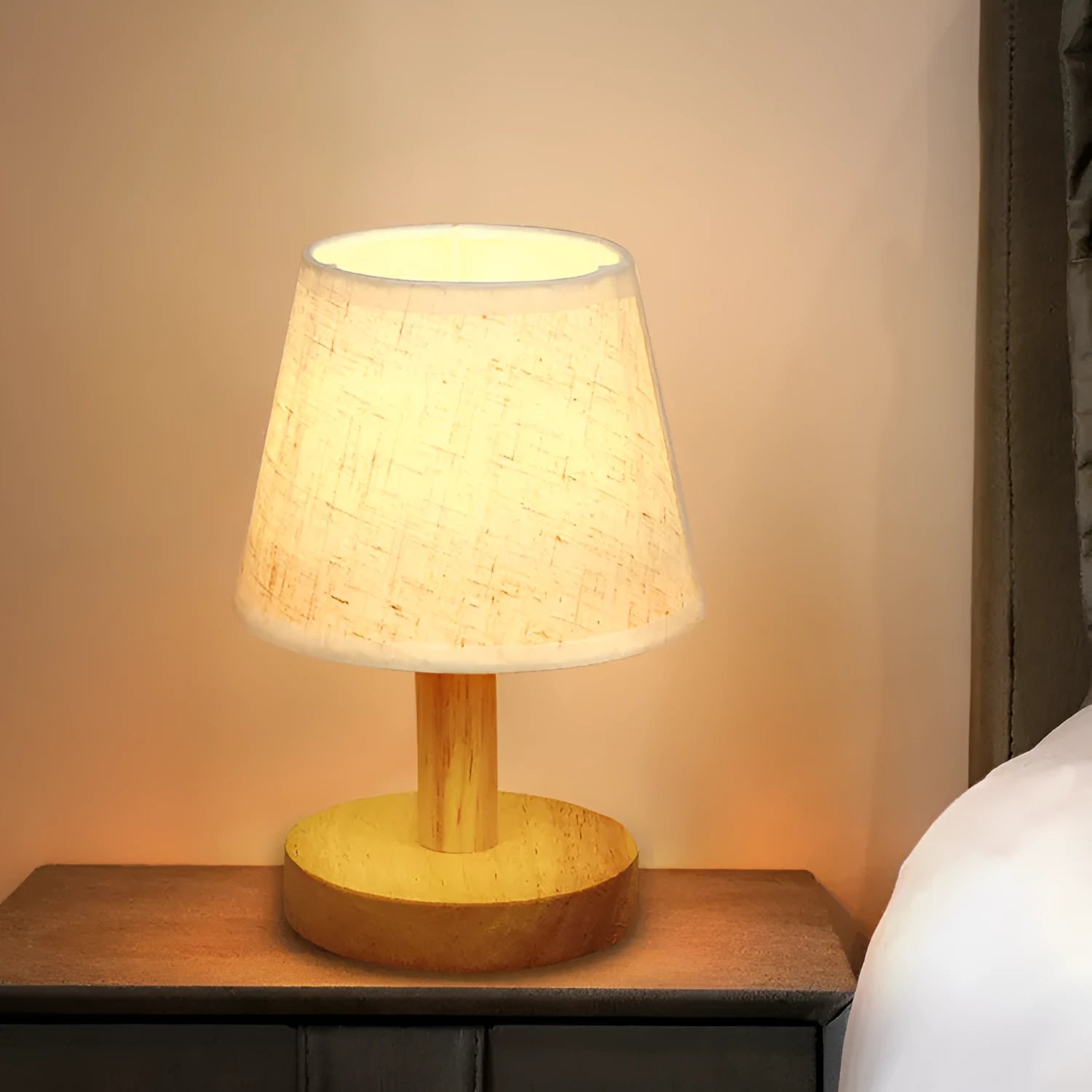 Vintage pleated table lamp with jute and linen shade on bamboo base, featuring USB charging and three-colour dimming.