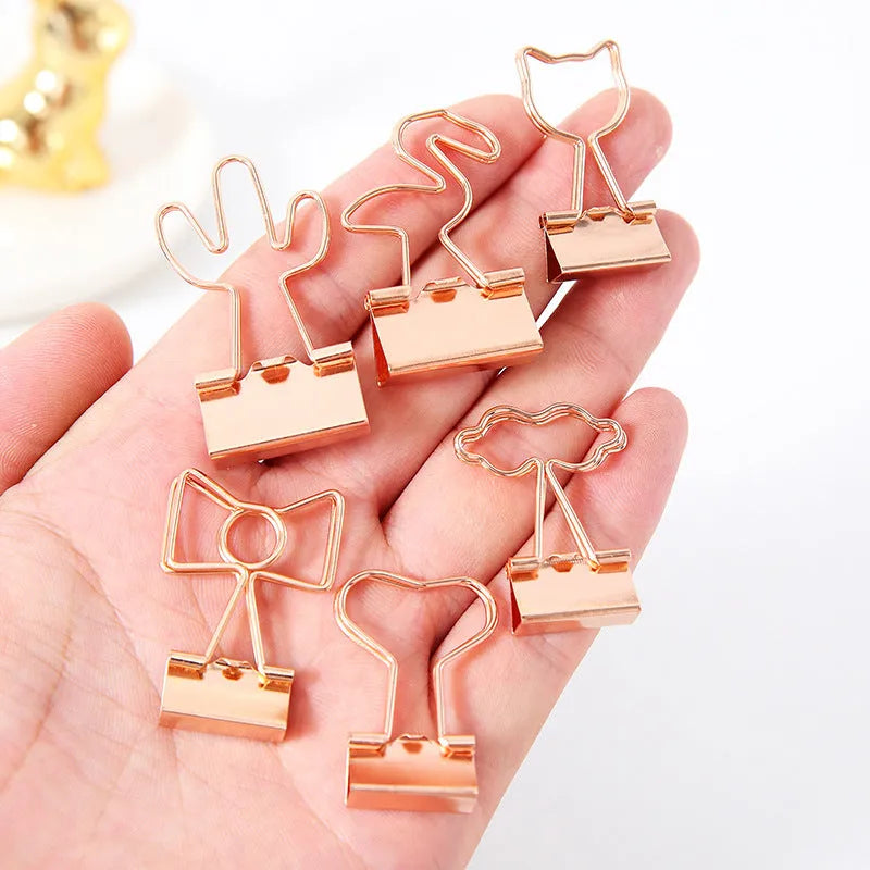 Gold metal decorative paper clip with long tail design in various shapes including flamingo, love and cat