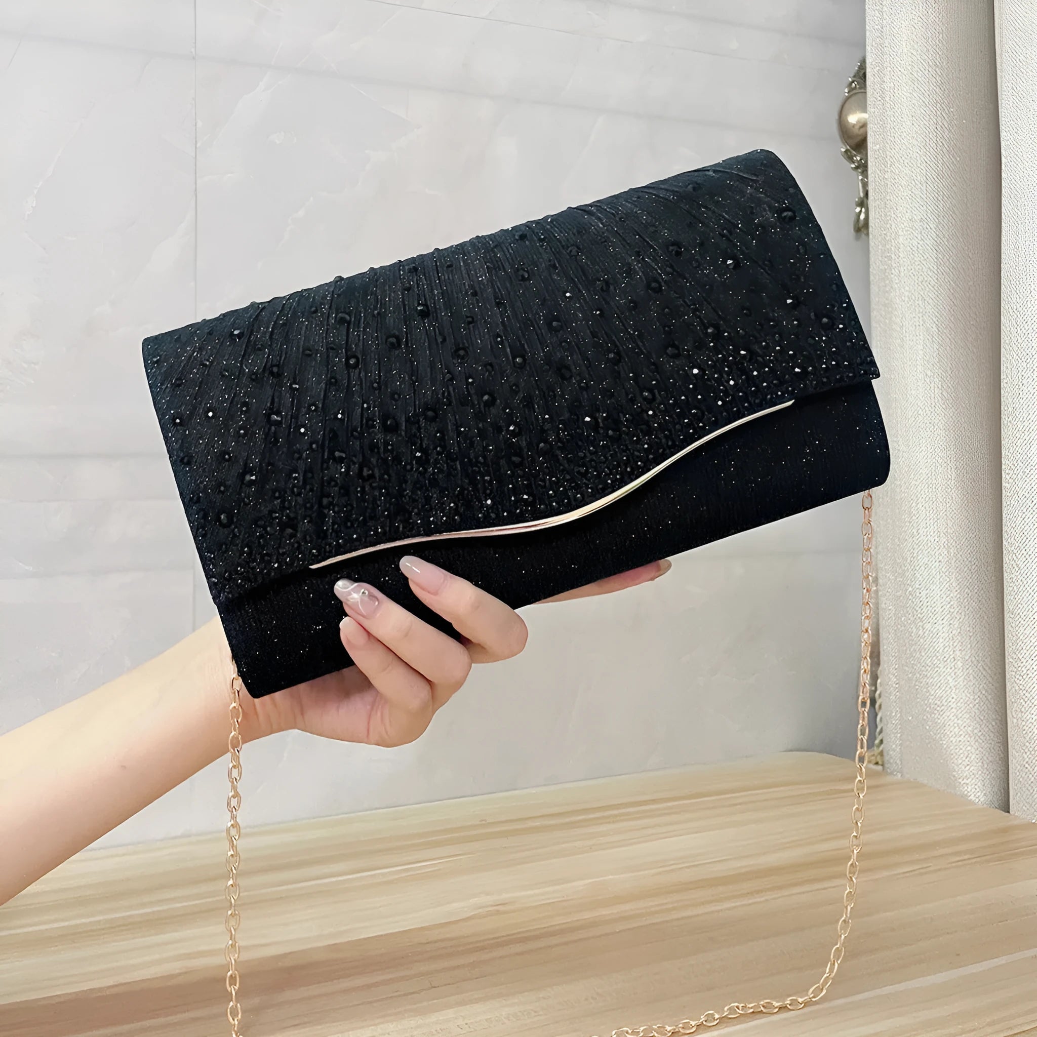 Women's dinner clutch bag in woven fabric with rhinestone dress garment design, available in black, champagne, and silver