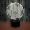 Football-shaped 3D night light with colour-changing acrylic panel on ABS base