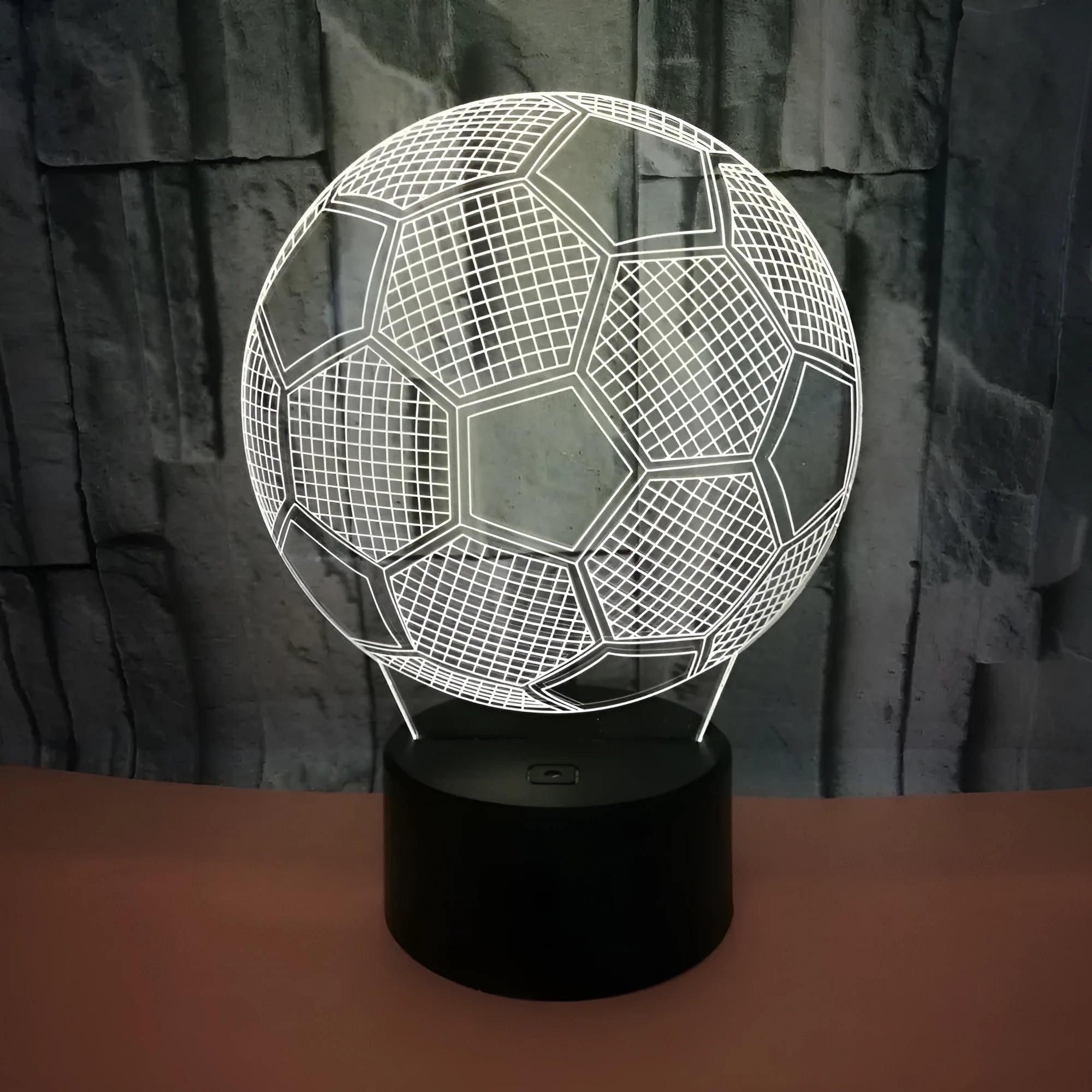 Football-shaped 3D night light with colour-changing acrylic panel on ABS base