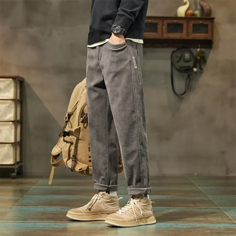Corduroy men's casual straight-leg trousers in solid colour with mid-waist rise and zipper fly