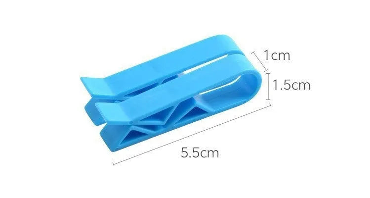 White PP plastic non-slip clip holding a black bin liner to the side of a silver kitchen trash can.
