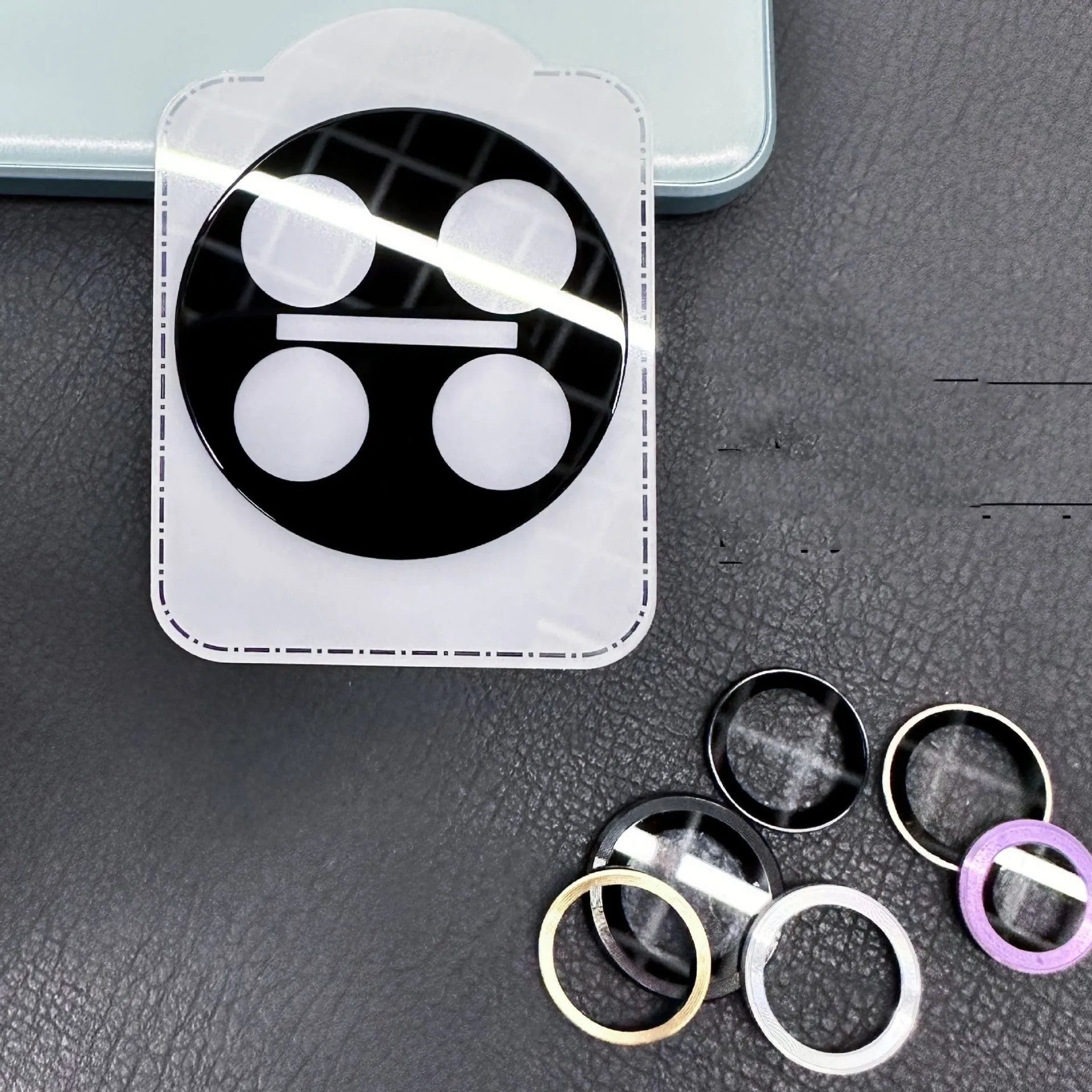 Tempered glass lens protector with black ring for OnePlus 12, Find N3, and OnePlus 11 phones.