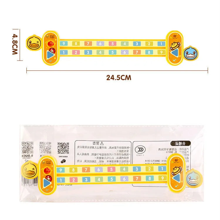 Yellow plastic children's digital resolution ruler with cartoon graphics, showing centimetre and millimetre scales.