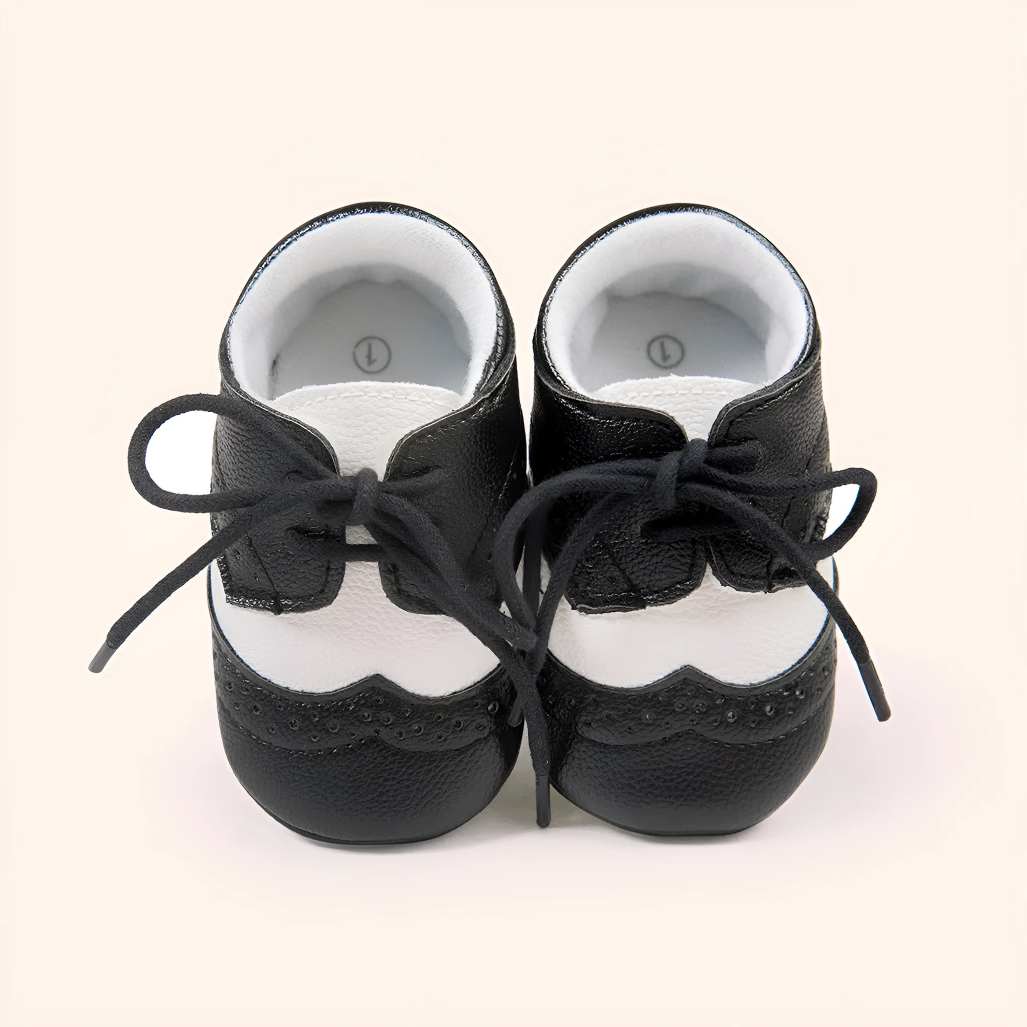 Vintage style baby boys soft sole walking shoes in synthetic leather.