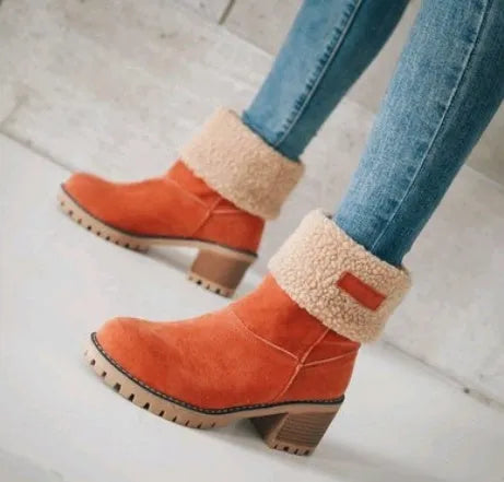 Women's mid-tube suede snow boot in black with a thick heel and round toe.