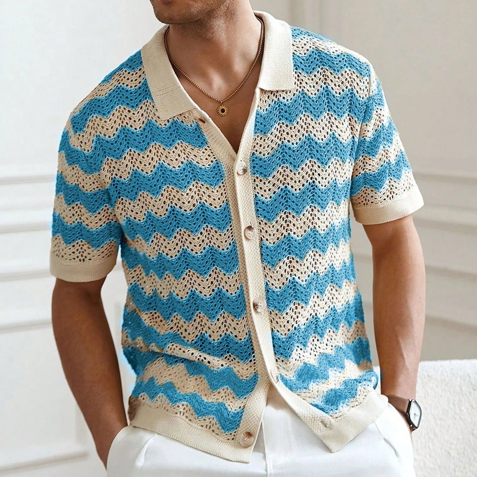 Short-sleeved blue corrugated knit sweater with a hollow jacquard texture on a hanger.