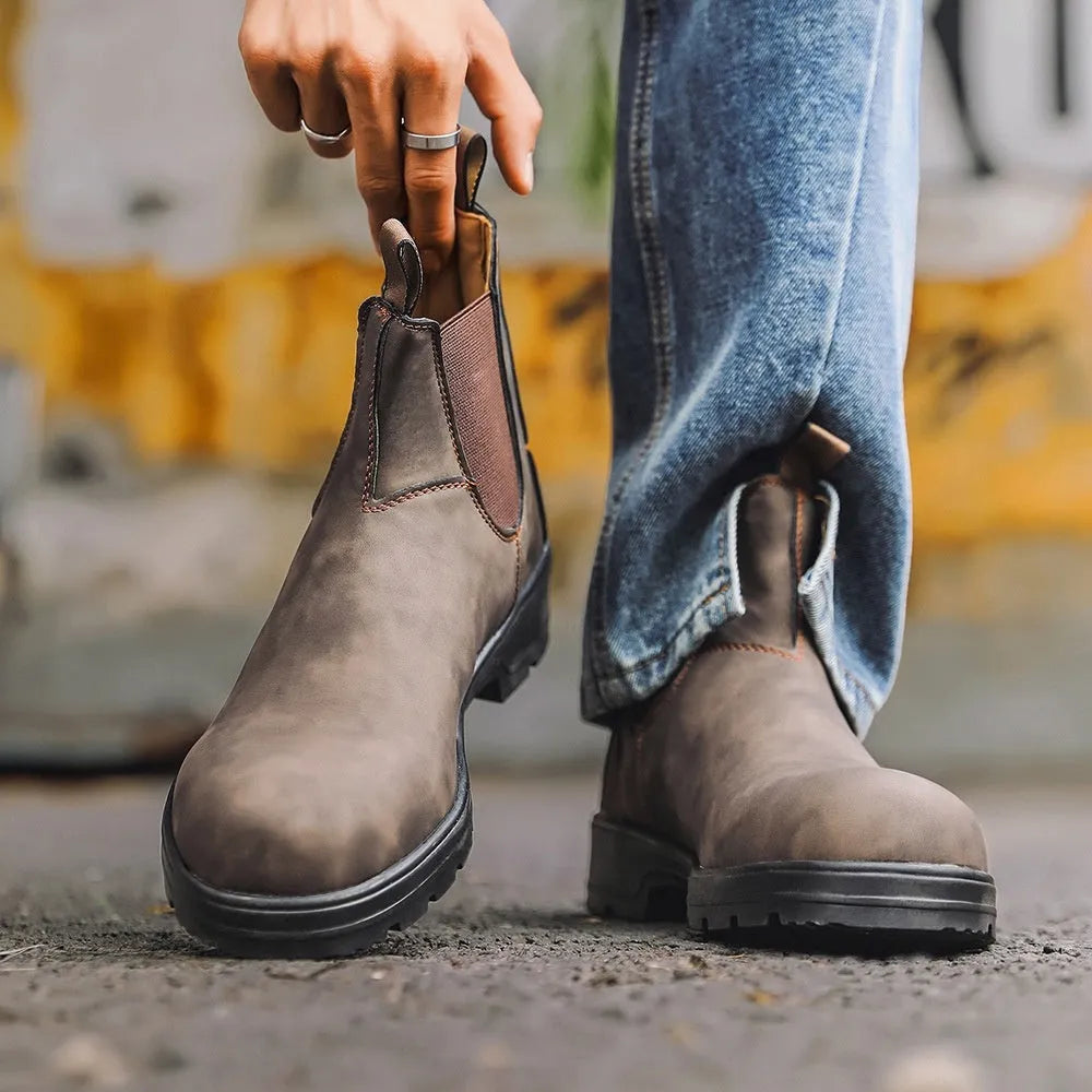 A pair of vintage-style unisex Chelsea boots in artificial PU leather with a beef tendon sole