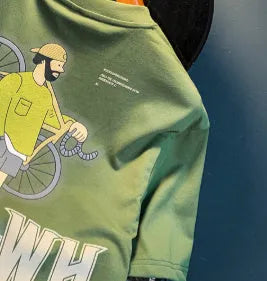 Green men's t-shirt with printed literary youth design showing loose fit and short sleeves