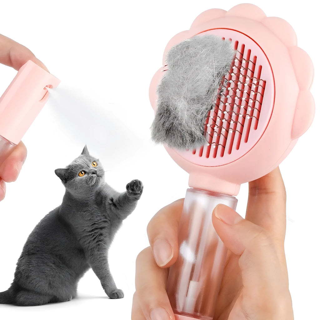 Grey spray cat grooming brush with self-cleaning button and curved stainless steel bristles on a white background.