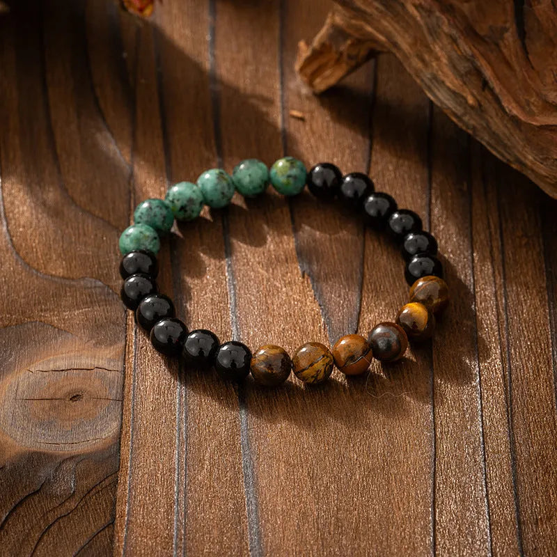 Vintage bohemian style natural stone bead necklace and bracelet set showing geometric round beads and tassel detailing