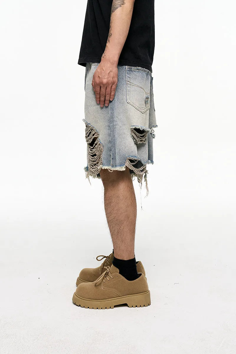 Light blue washed men's denim shorts with a baggy wide leg fit on a mid waist.