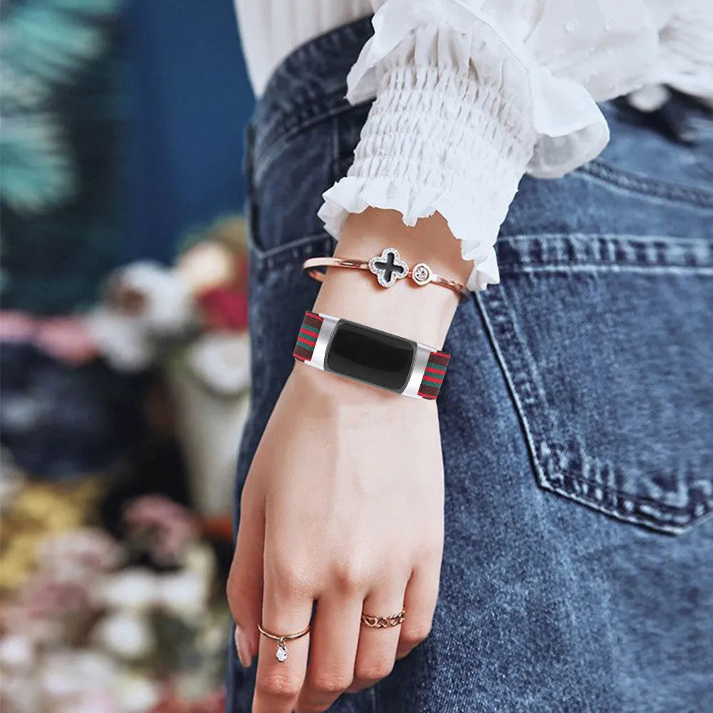 Printed elastic watch strap for Fitbit Charge 6 showing rainbow and arrow print options