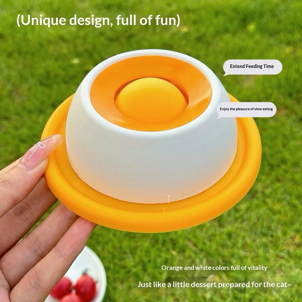 Yellow anti-spill slow feeder cat toy treat dispenser for cats on floor