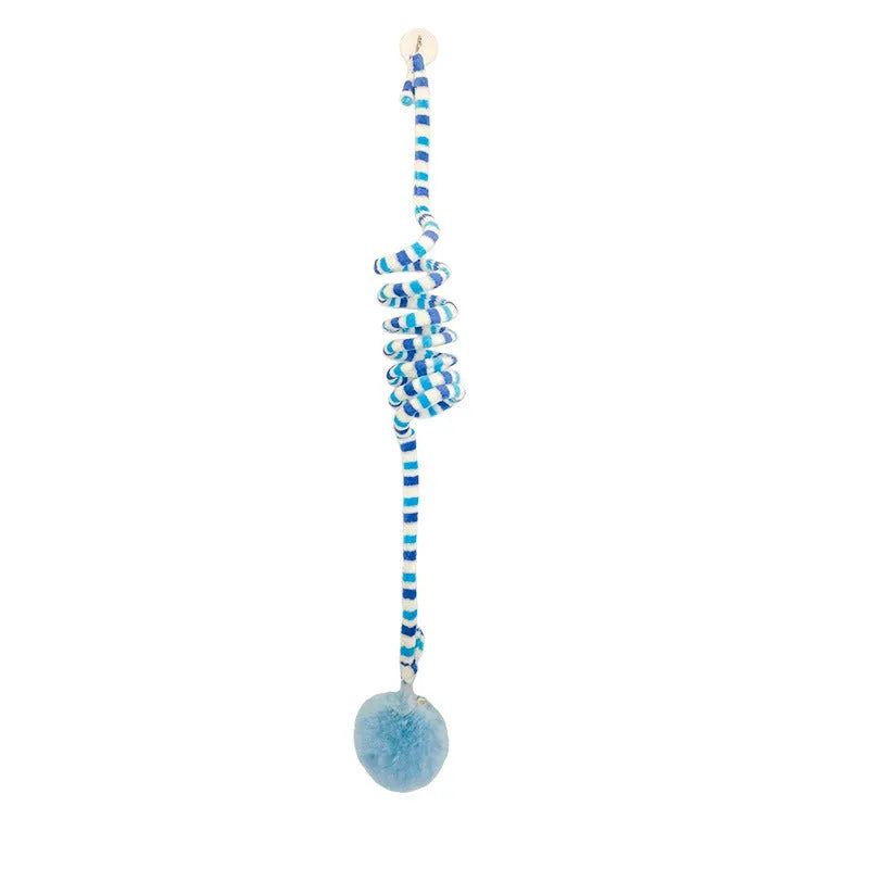 Hanging cat toy with bell stick and red inflatable ball attached to a glass door by a suction cup.