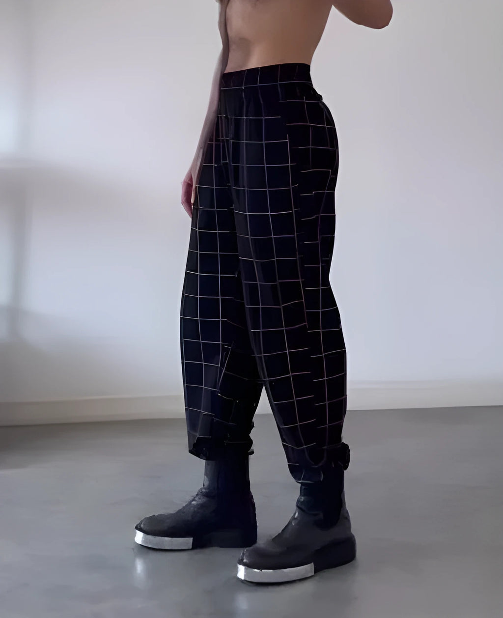 Men's plaid trousers with apron waist and elasticated back in tartan pattern with two utility pockets