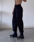 Men's plaid trousers with apron waist and elasticated back in tartan pattern with two utility pockets
