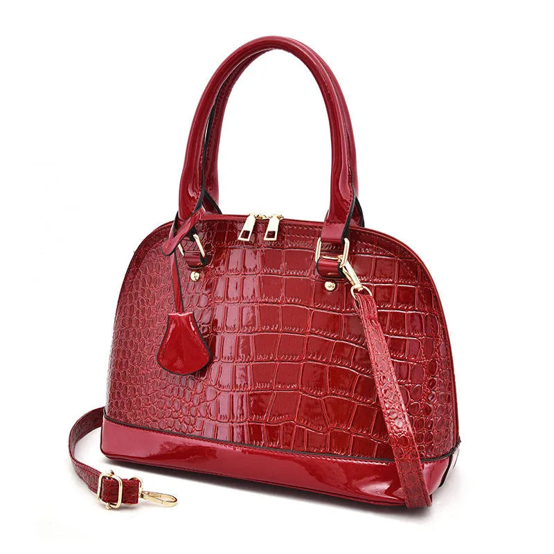 Large shiny black PU leather crossbody shoulder bag with structured shell shape