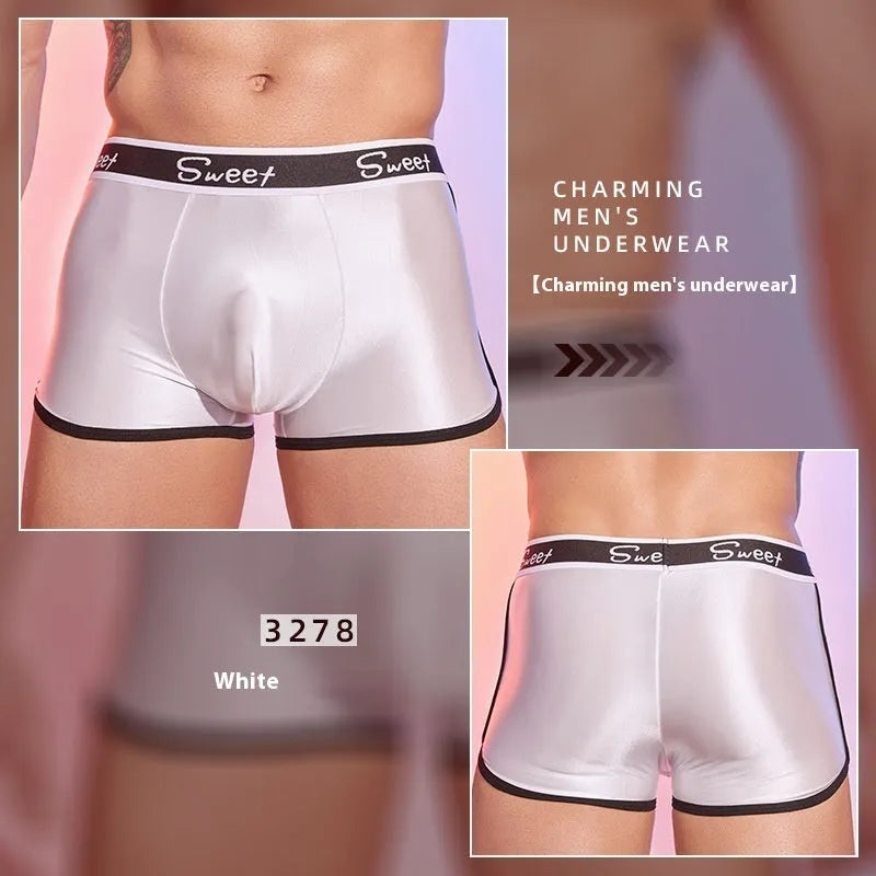 Men's shiny silky nylon boxer shorts in black, white, and sapphire blue colours showing breathable construction