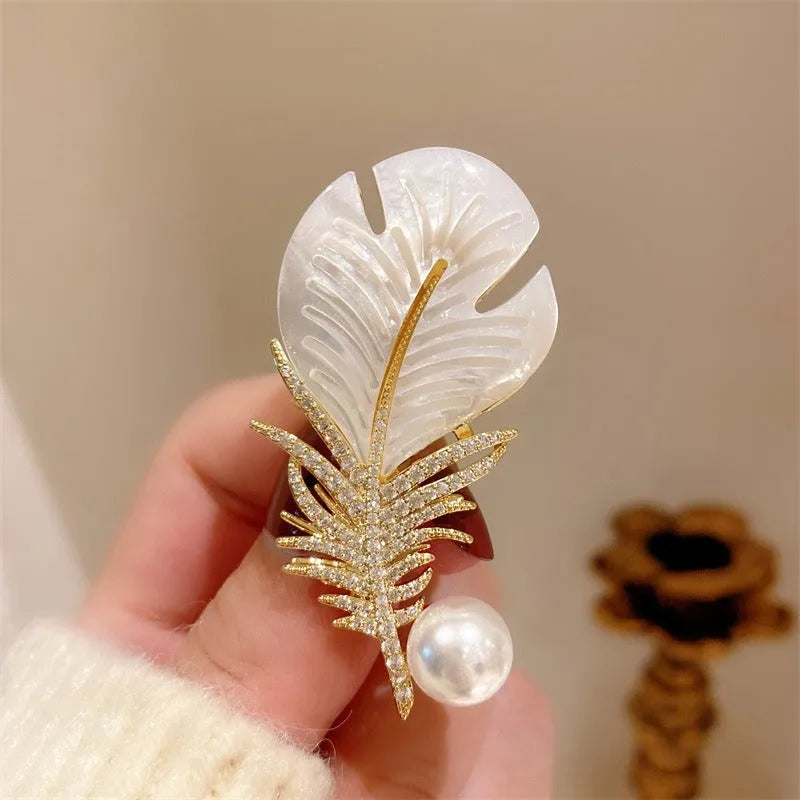 Alloy brooch in natural flower shape with electroplated finish, featuring adjustable and anti-exposure pin closure for women's coats and suits.
