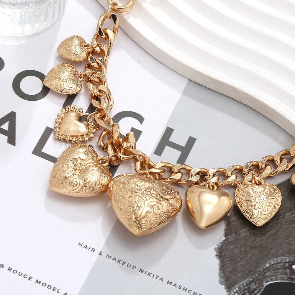 Women's exaggerated carved heart pendant necklace with dripping oil finish in gold and white K colours