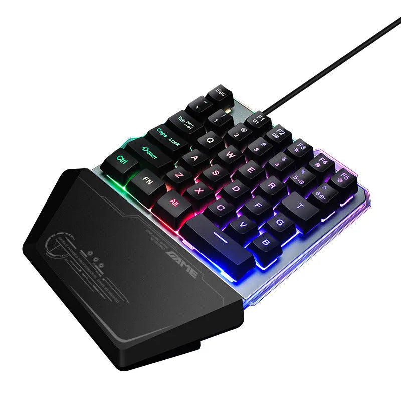 Black robotic one-handed G40 keyboard with RGB backlit keys on a desk.