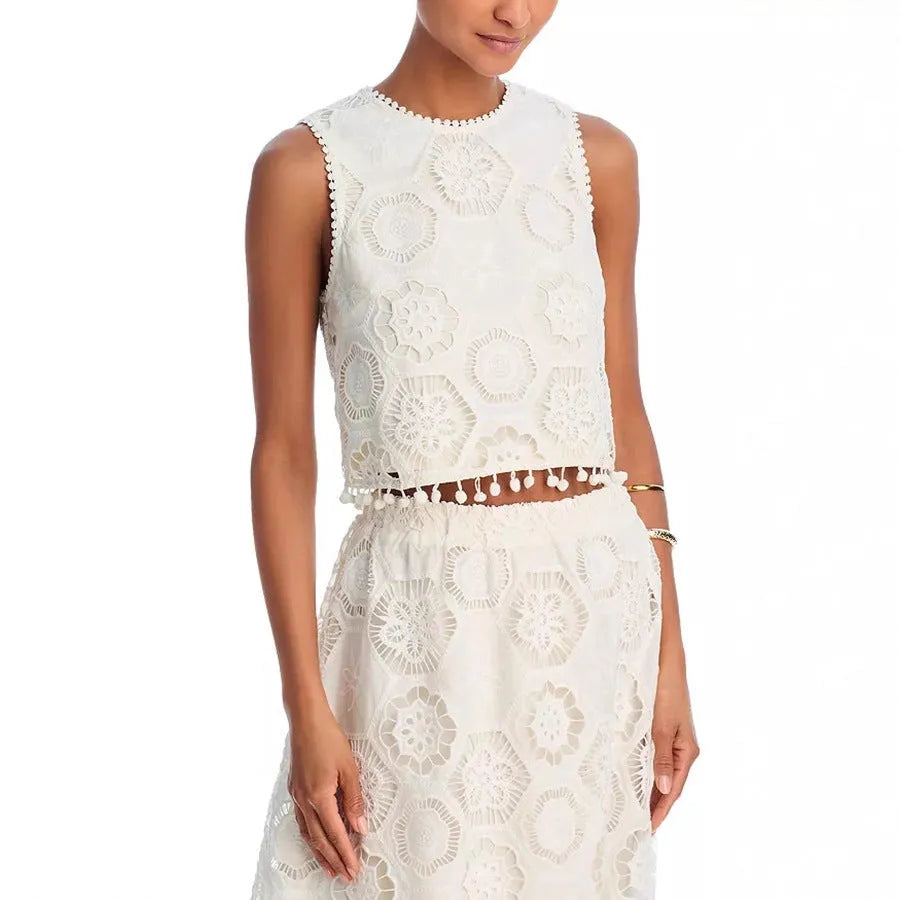 White women's retro style suit with sleeveless top, embroidered long skirt on hanger