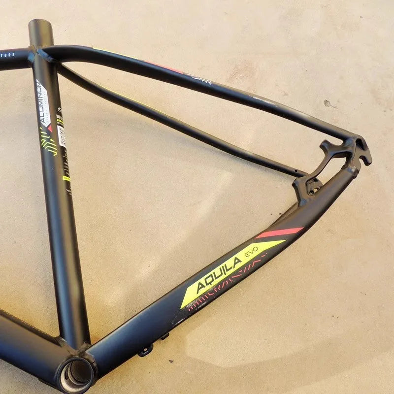 29-inch black-green aluminium mountain bike frame with disc brake mounts and inner cable routing