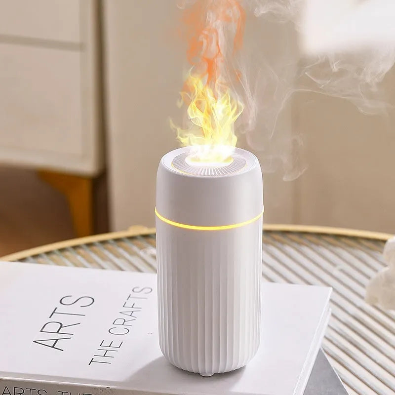 Car flame design aroma diffuser with automatic sprayer in black or white, measuring 70x70x143mm