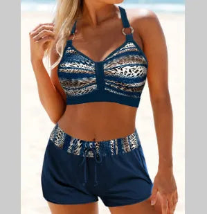 Women's navy blue and print two-piece bikini swimsuit made from polyester.