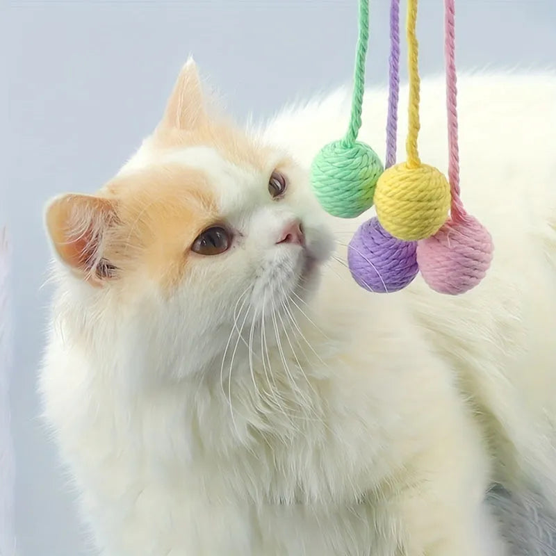 Colourful cat toy ball with rope tail and internal jingle bell in two size options