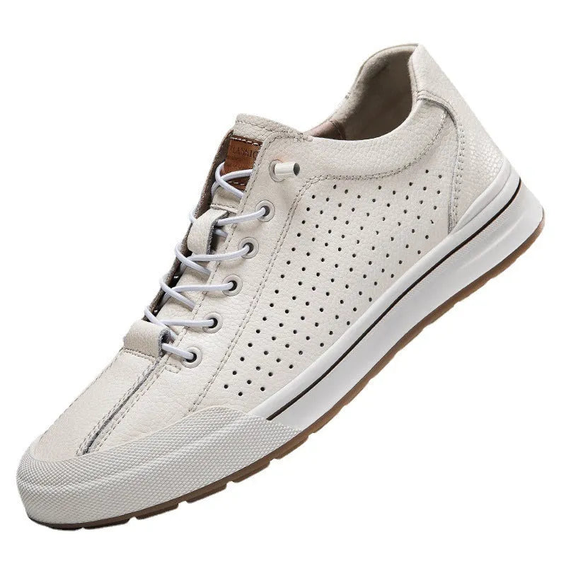 Men's white leather casual shoes with flat heel and round toe on a plain background