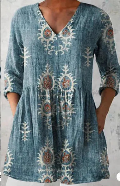 Women's long loose dress with a blue and white wave print pattern, featuring three-quarter sleeves and a wide waist.