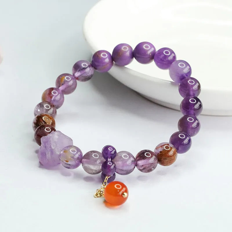 Purple amethyst crystal bracelet with red agate stones measuring 8mm beads