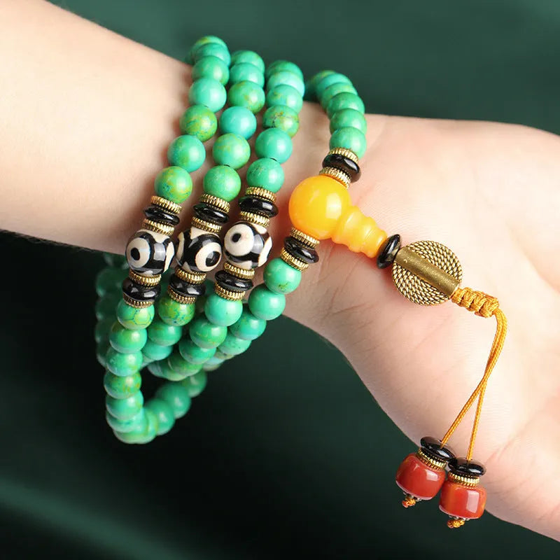 Natural turquoise gemstone bracelet with 108 round 8mm polished beads on a string.