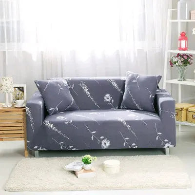 Geometric patterned stretch sofa slipcover fitted on a modern two-seater sofa.
