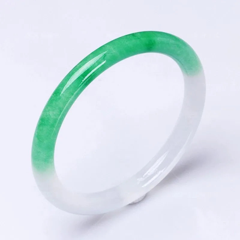Women's jade bracelet with floating flower design in ice-like emerald appearance
