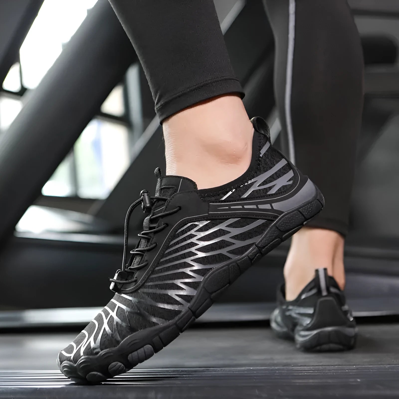 Men's white and black lace-up casual sports shoes with rubber sole on a plain background