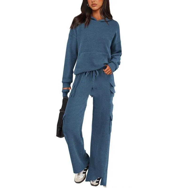 Women's long sleeve leisure sport suit top and trousers set in polyester fabric.