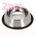 Classic stainless steel pet bowl with non-slip rubber base on a tiled floor