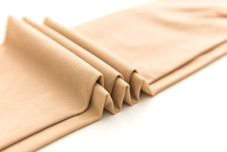 Beige and black hip and abdomen lifting stovepipe socks made from polyester fibre