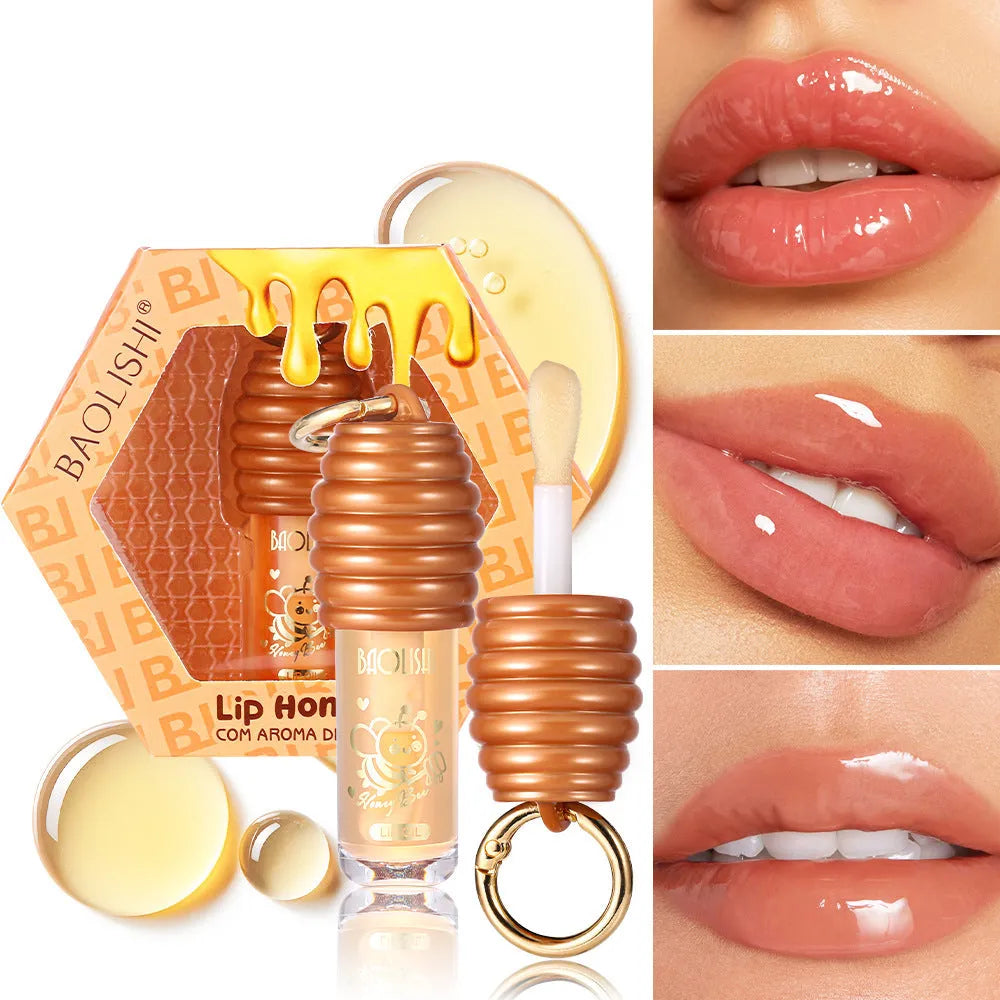 Honey lip gloss attached to keychain showing portable design